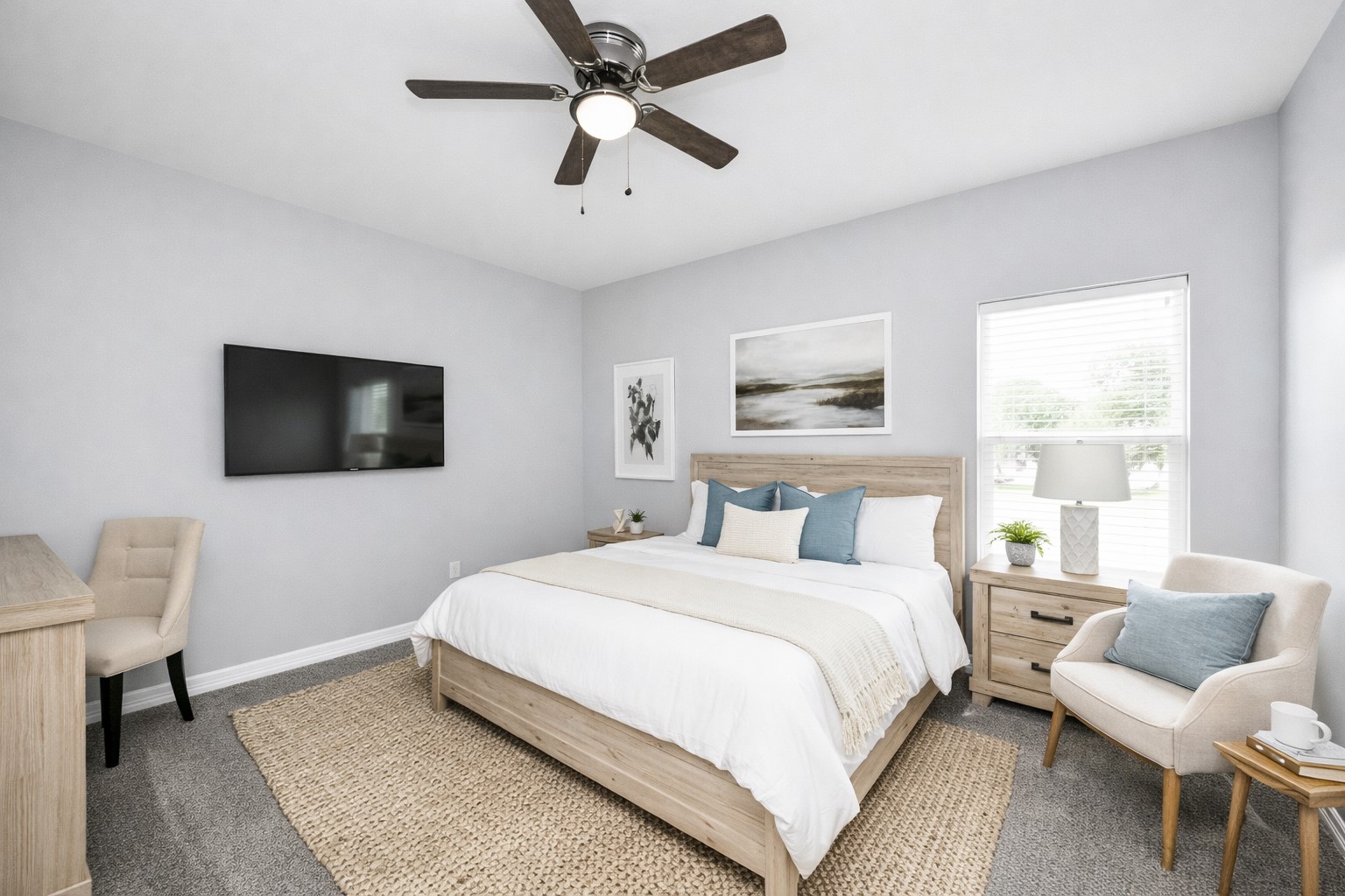 414 North 4th Street Beasley, TX 77417 - Photo 20 of 26 The final welcoming secondary bedroom offers a timeless neutral palette, a roomy closet, a ceiling fan for added comfort, and soft plush carpeting that enhances the cozy atmosphere - virtually staged.