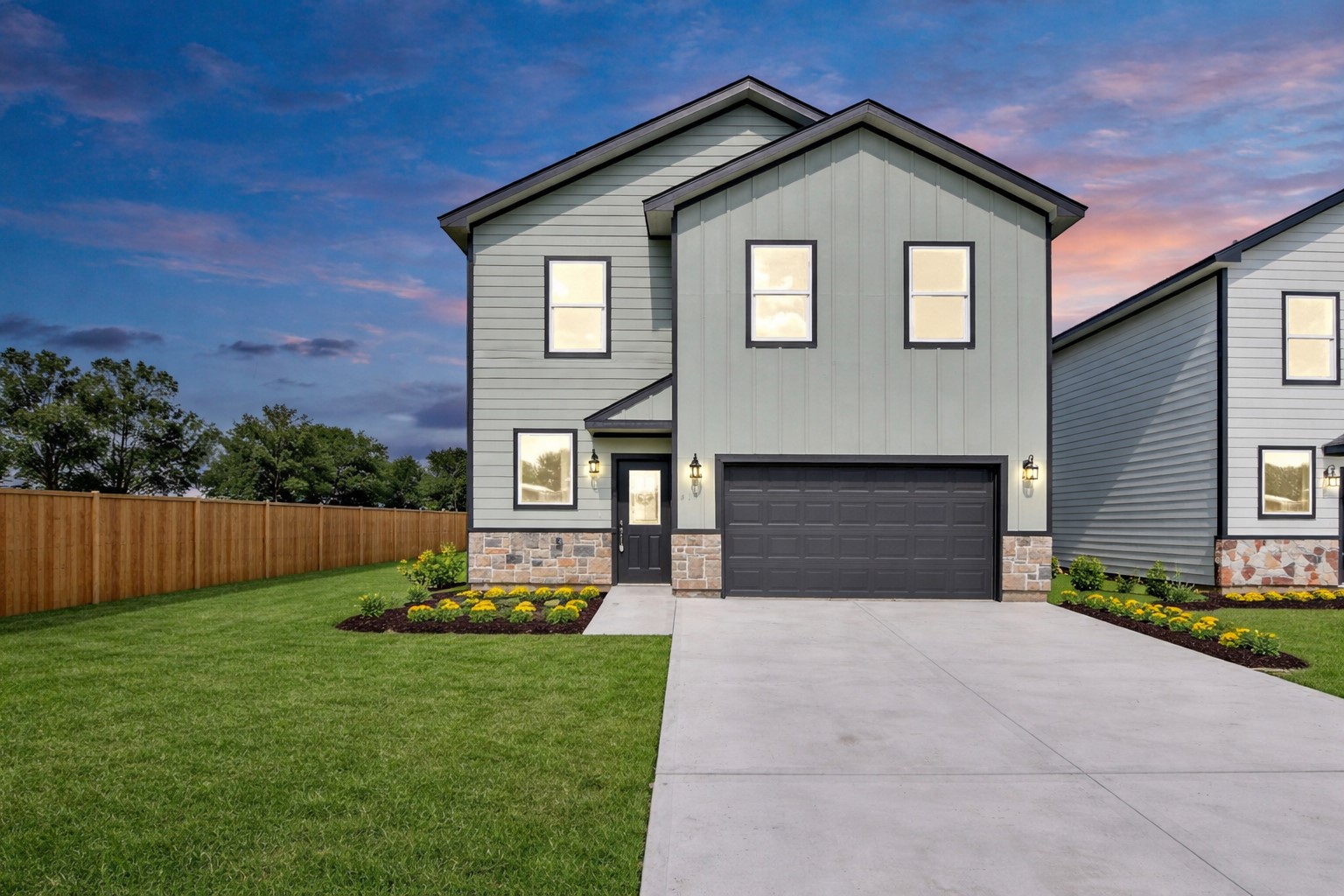414 North 4th Street Beasley, TX 77417 - Photo 2 of 26 This newly built home showcases a modern exterior with a stunning front elevation, blending clean architectural lines and a neutral color palette. Thoughtful landscaping enhances its curb appeal, featuring neatly trimmed shrubs and freshly laid lawn.