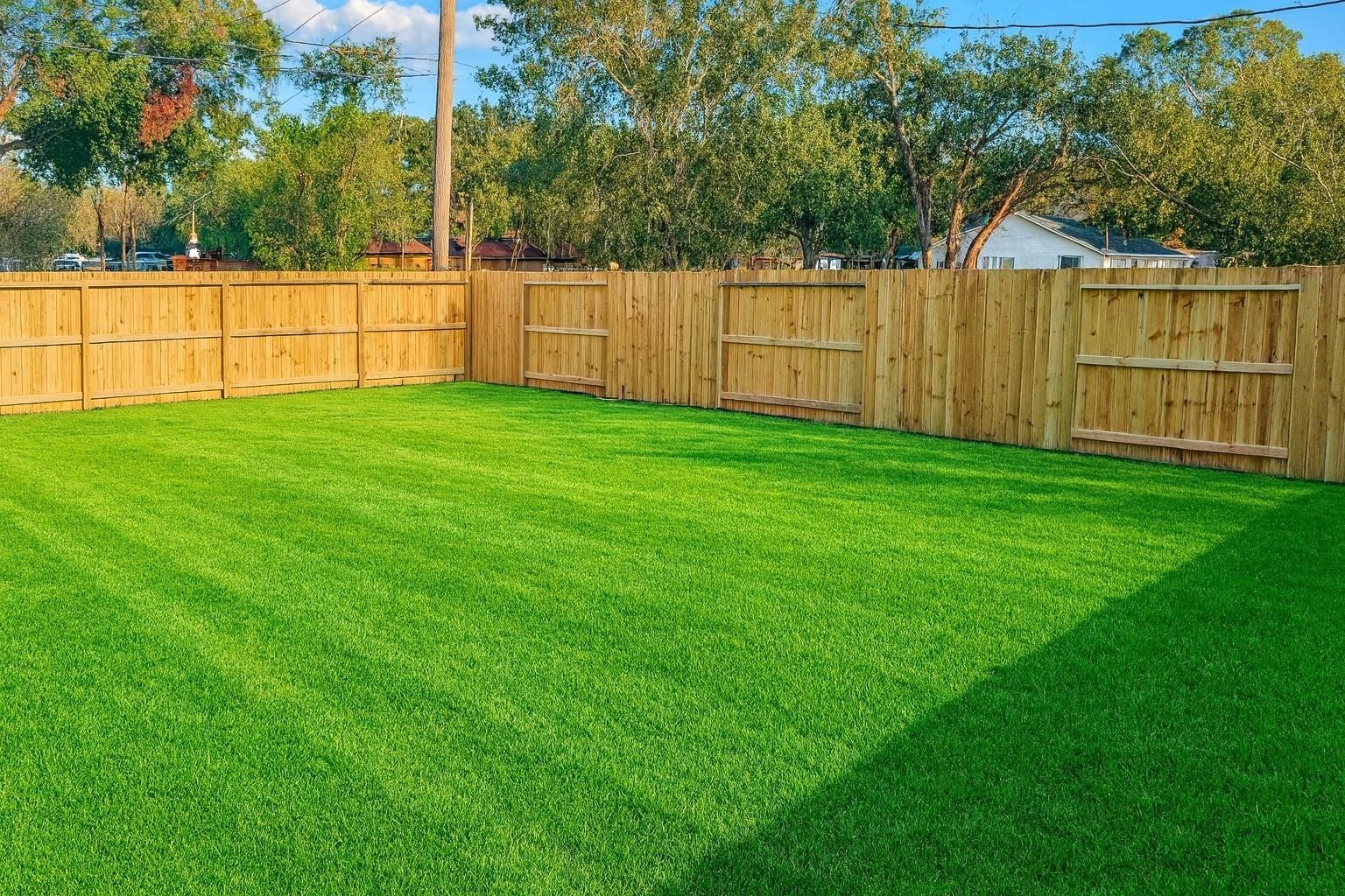 414 North 4th Street Beasley, TX 77417 - Photo 24 of 26 The large fully fenced backyard offers limitless potential, providing plenty of space to create your own personal retreat. Whether you’re looking to relax, entertain, or design your dream garden, this area invites you to bring your vision to life and craft the perfect outdoor space.