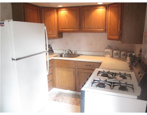 161 William Circle McKees Rocks, PA 15136 - Photo 4 of 12 Kitchen. The kitchen features oak cabinetry and includes all appliances.