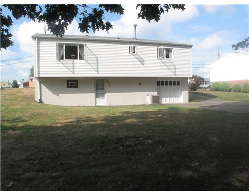 161 William Circle McKees Rocks, PA 15136 - Photo 10 of 12 Exterior Back. A view of the rear exterior and the level backyard.