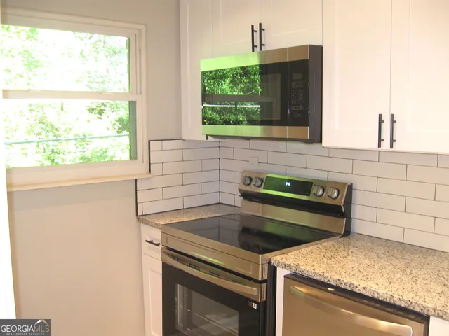 a kitchen with a stove and a sink
