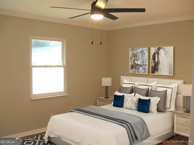 a bedroom with a bed and a window