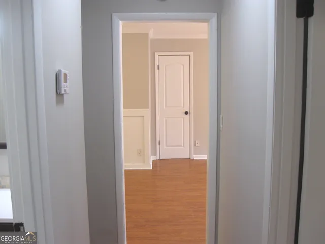 a view of a bathroom from a hallway