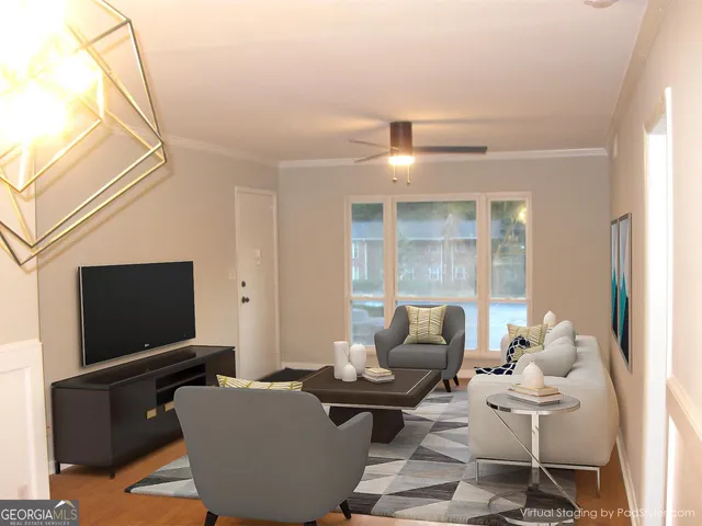 a living room with furniture and a flat screen tv