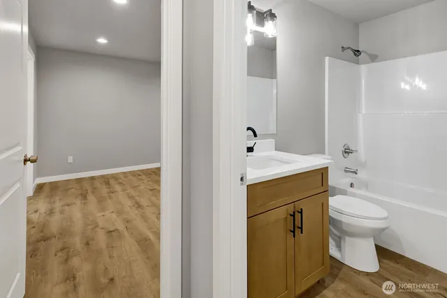 a bathroom with a sink a toilet and a bathtub