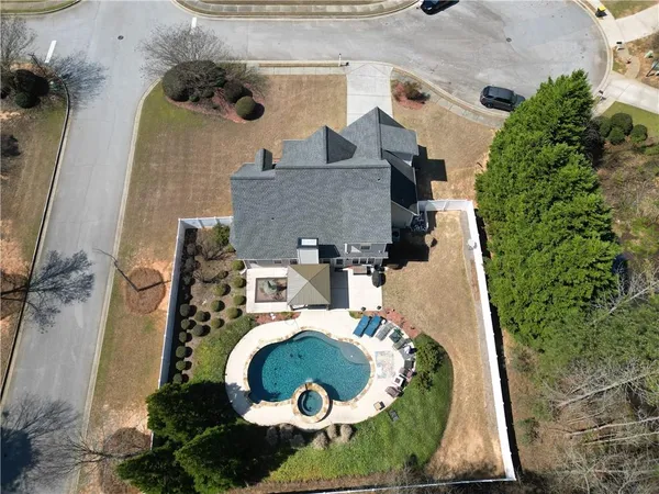 an aerial view of a house with swimming pool