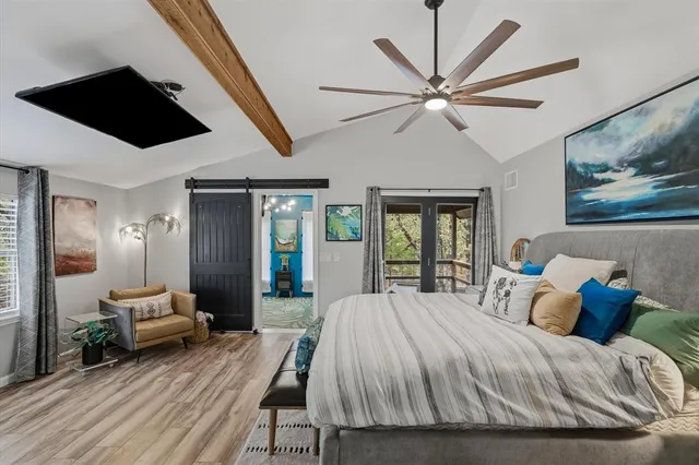 a living room with furniture a rug and a chandelier