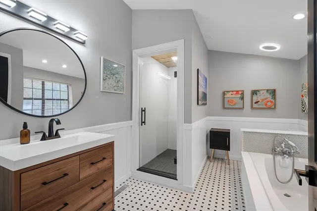 a bathroom with a bathtub and a shower