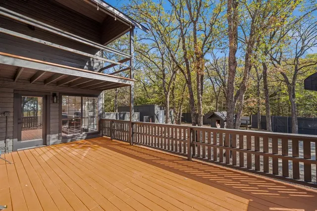 a view of a house with a yard covered in snow