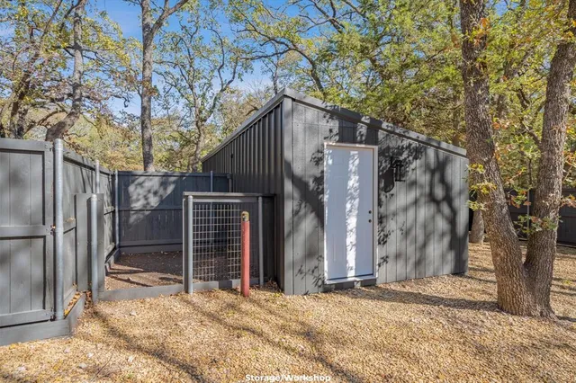a view of a backyard with a tree