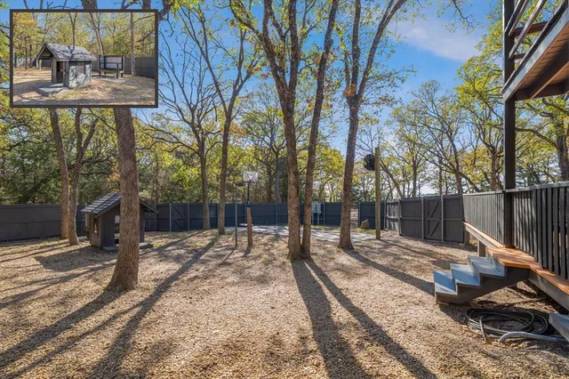 a view of a house with a chairs and table in patio