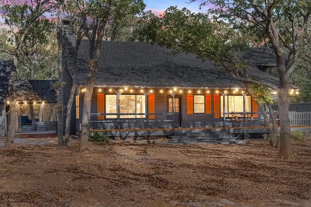 a backyard of a house with outdoor seating