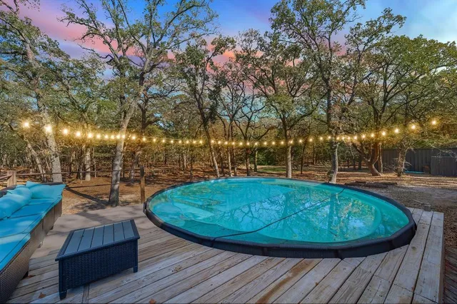 a view of a swimming pool with a patio
