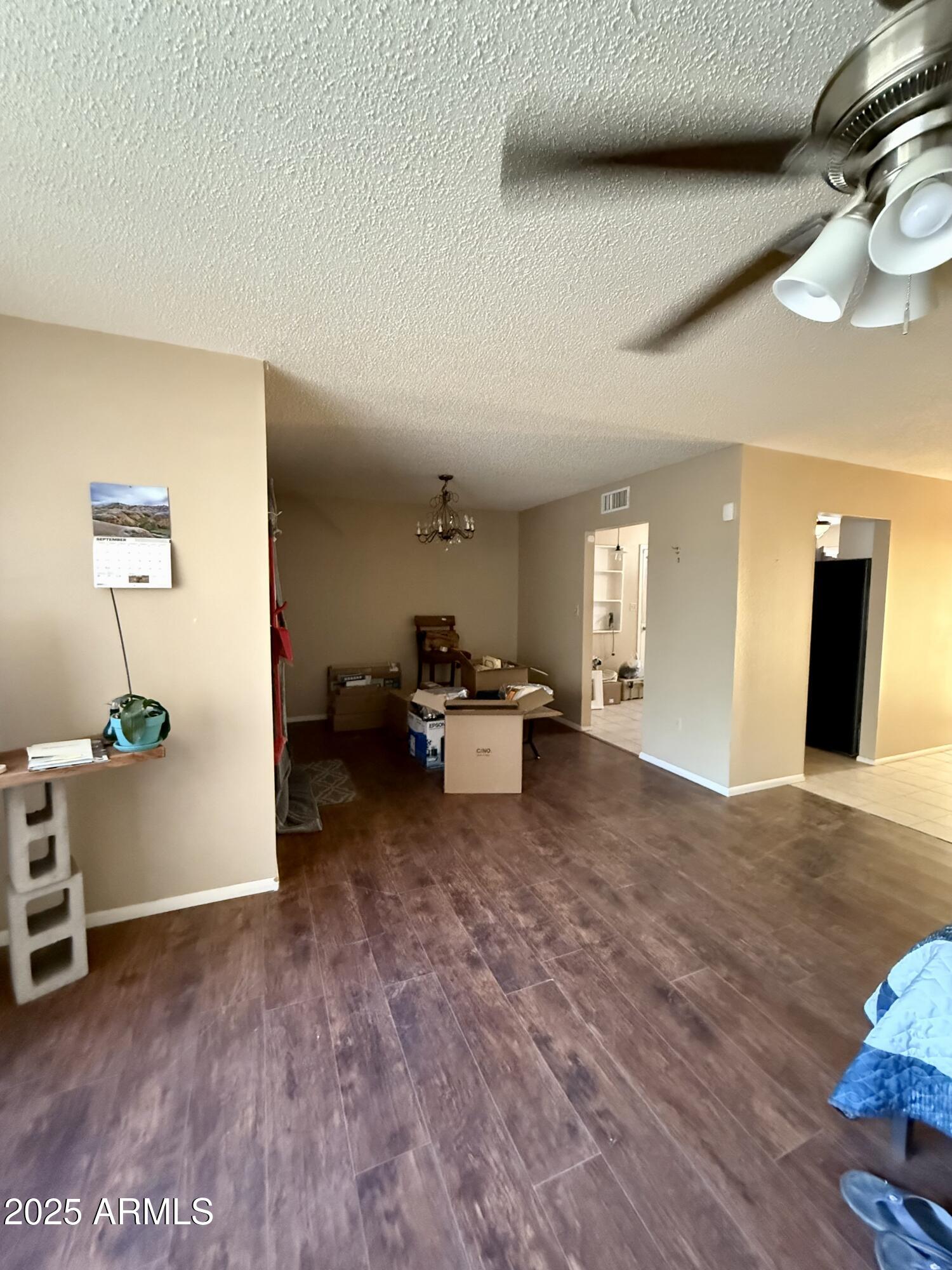 5856 Colby Street Mesa, AZ 85205 - Photo 13 of 18 a living room with furniture and a wooden floor