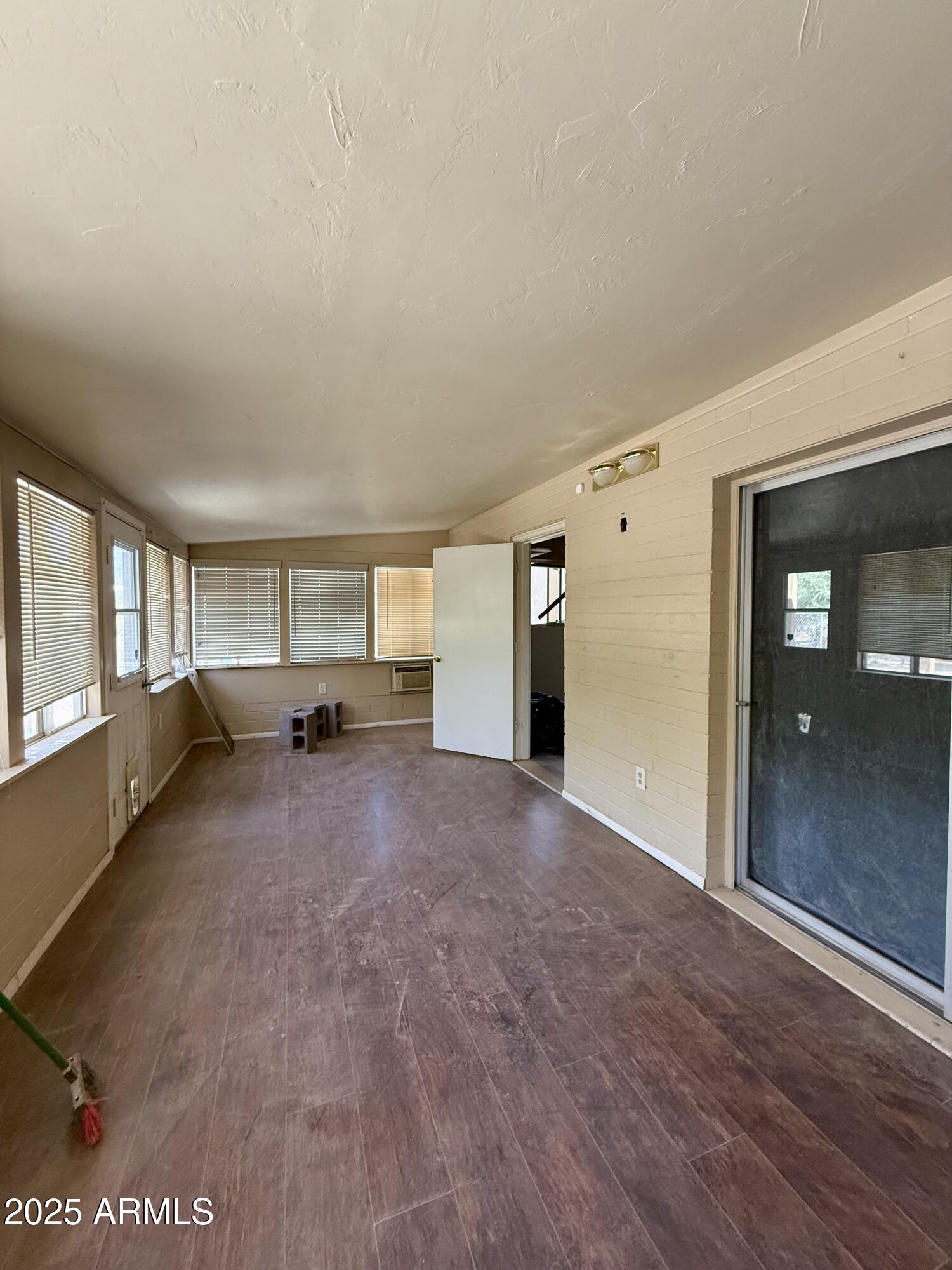 5856 Colby Street Mesa, AZ 85205 - Photo 16 of 18 a view of empty room with wooden floor