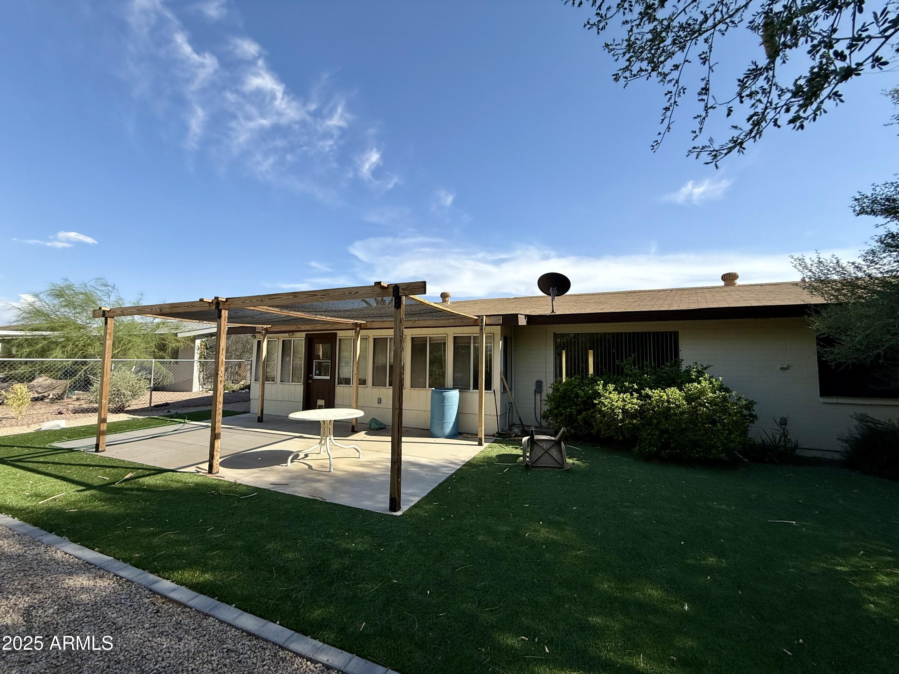 5856 Colby Street Mesa, AZ 85205 - Photo 18 of 18 a view of a house with backyard porch and sitting area
