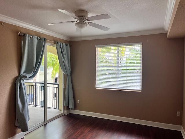 3 Renaissance Way, Unit 411 Boynton Beach, FL 33426 - Photo 6 of 8 a view of empty room with wooden floor and fan