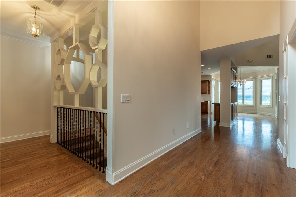 5739 Ridgewater Circle Gainesville, GA 30506 - Photo 18 of 93 a view of a hallway with wooden floor