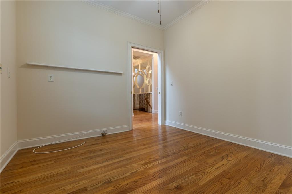 5739 Ridgewater Circle Gainesville, GA 30506 - Photo 20 of 93 a view of an empty room with wooden floor and a window
