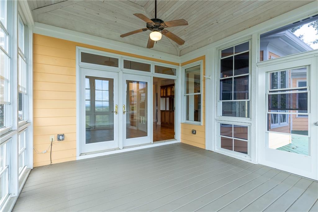 5739 Ridgewater Circle Gainesville, GA 30506 - Photo 29 of 93 a view of an entryway with wooden floor and a ceiling fan