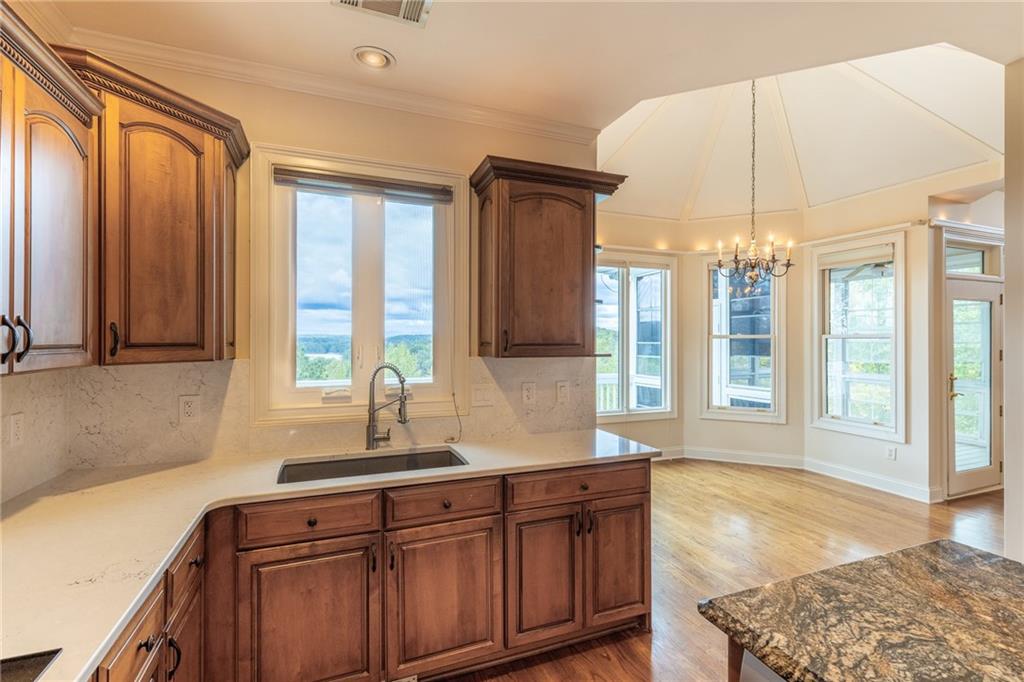 5739 Ridgewater Circle Gainesville, GA 30506 - Photo 36 of 93 a spacious bathroom with a granite countertop sink and a bathtub