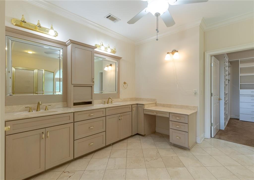 5739 Ridgewater Circle Gainesville, GA 30506 - Photo 45 of 93 a large bathroom with a double vanity sink a large mirror and a bathtub