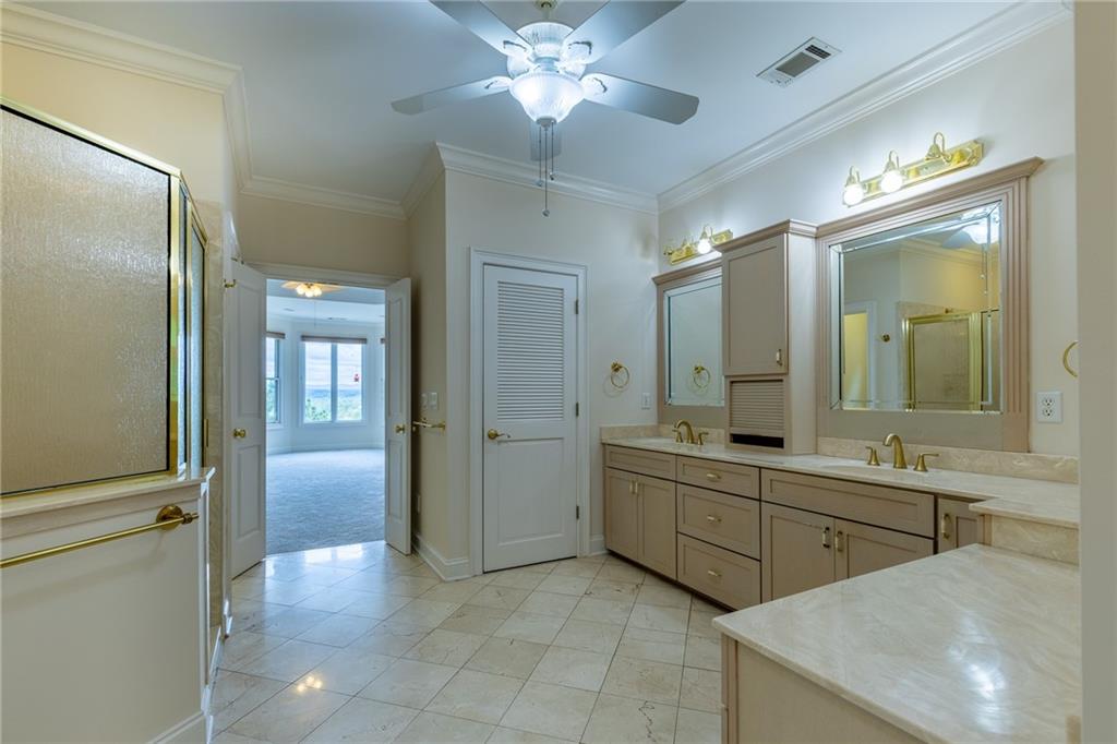 5739 Ridgewater Circle Gainesville, GA 30506 - Photo 46 of 93 a spacious bathroom with a double vanity sink and a mirror