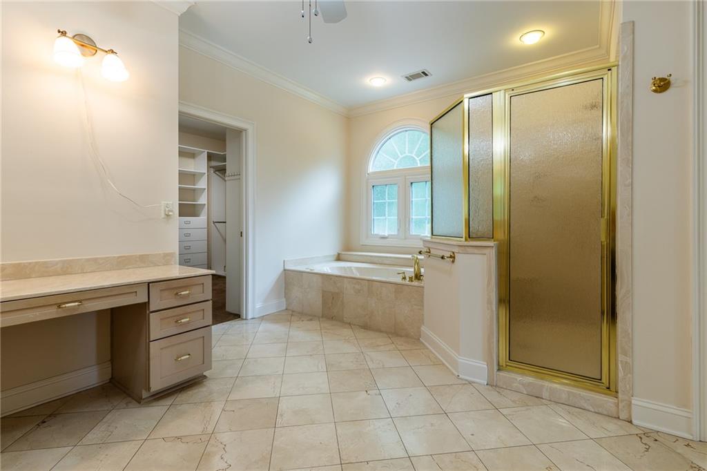 5739 Ridgewater Circle Gainesville, GA 30506 - Photo 48 of 93 a bathroom with a granite countertop sink a toilet and mirror