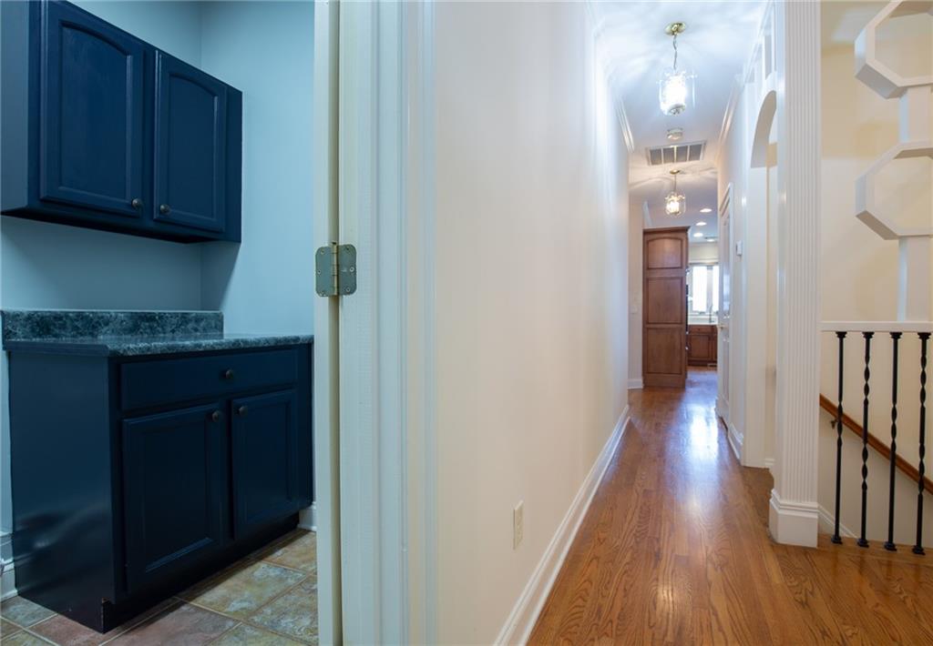 5739 Ridgewater Circle Gainesville, GA 30506 - Photo 52 of 93 a view of a hallway with wooden floor and staircase