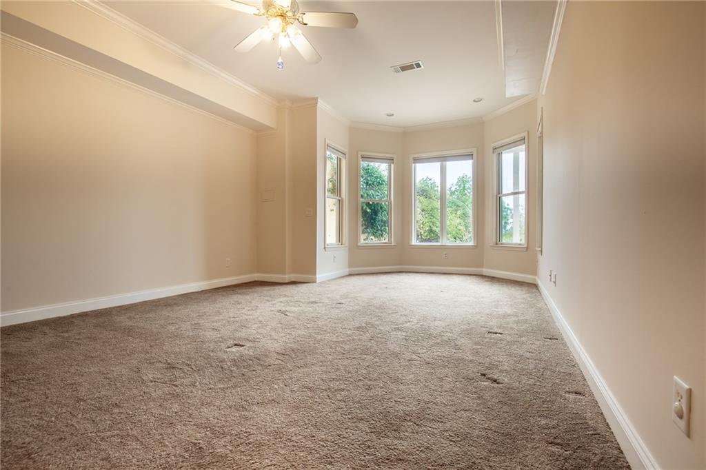 5739 Ridgewater Circle Gainesville, GA 30506 - Photo 62 of 93 an empty room with windows and ceiling fan