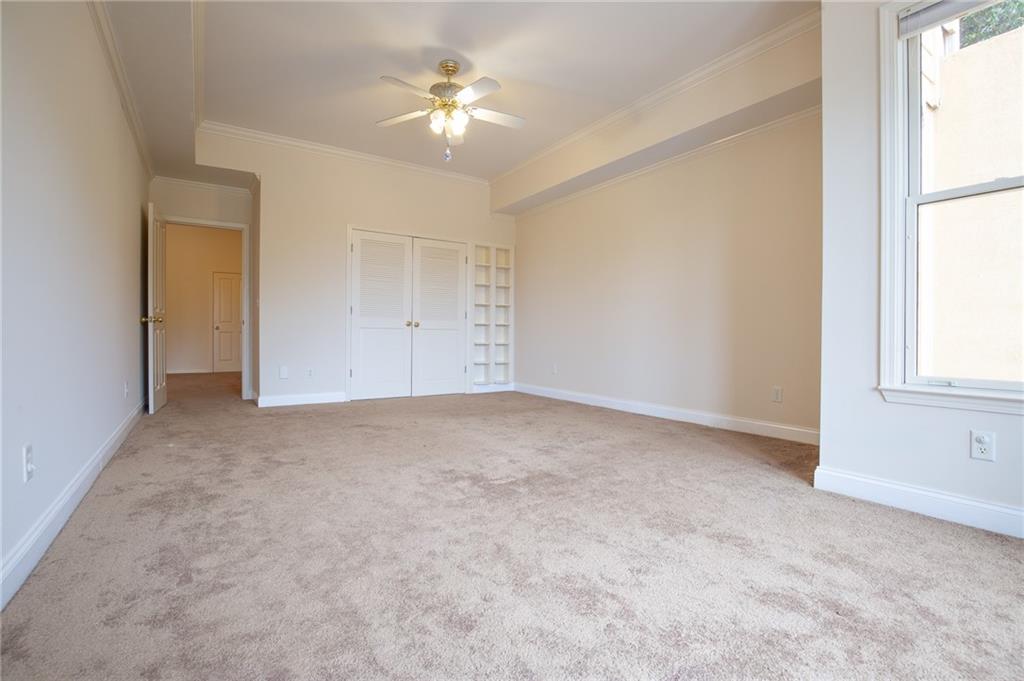 5739 Ridgewater Circle Gainesville, GA 30506 - Photo 65 of 93 an empty room with windows and fan