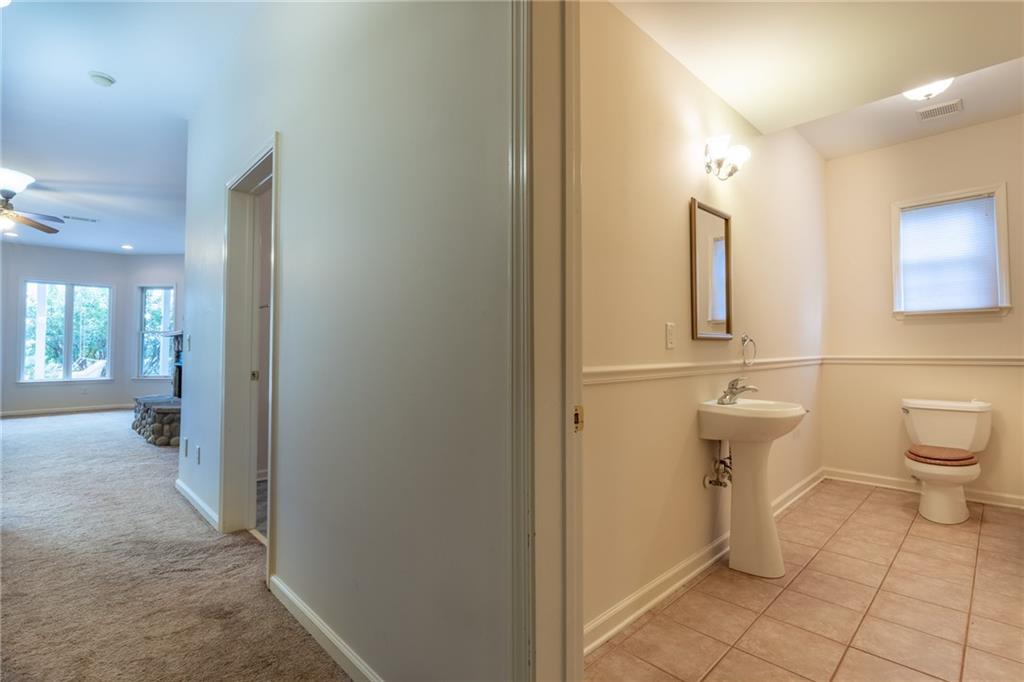 5739 Ridgewater Circle Gainesville, GA 30506 - Photo 68 of 93 a bathroom with a toilet sink and shower