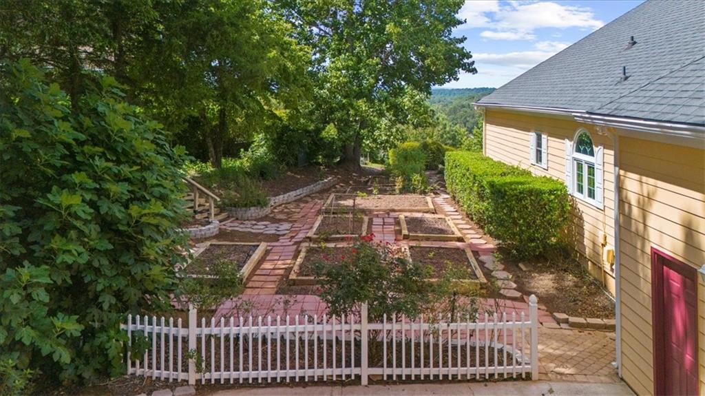 5739 Ridgewater Circle Gainesville, GA 30506 - Photo 81 of 93 a view of a yard with plants and large trees