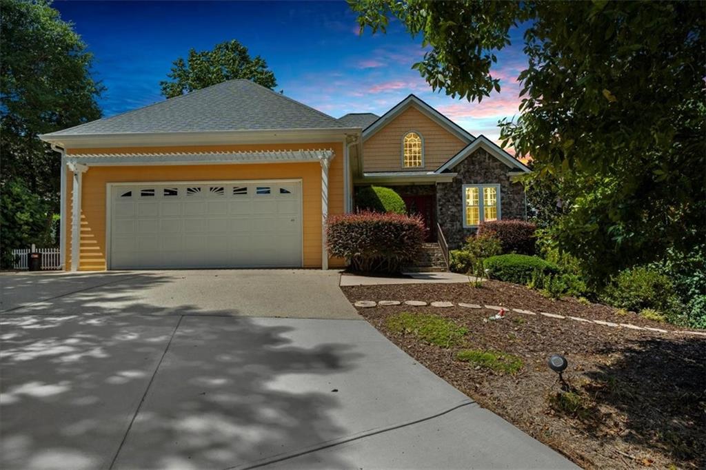 5739 Ridgewater Circle Gainesville, GA 30506 - Photo 84 of 93 a front view of a house with a yard and garage