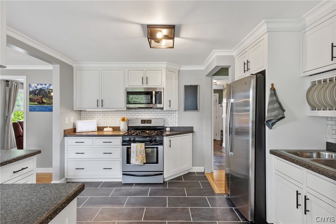 132 East Manchester Road Geddes, NY 13219 - Photo 14 of 44 Under-cabinet lighting enhances this space with st
