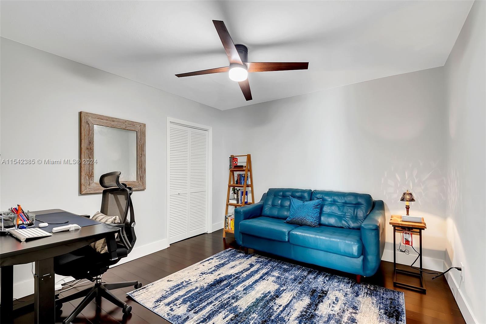 2521 Southwest 25th Terrace Miami, FL 33133 - Photo 14 of 26 a living room with furniture and a wooden floor