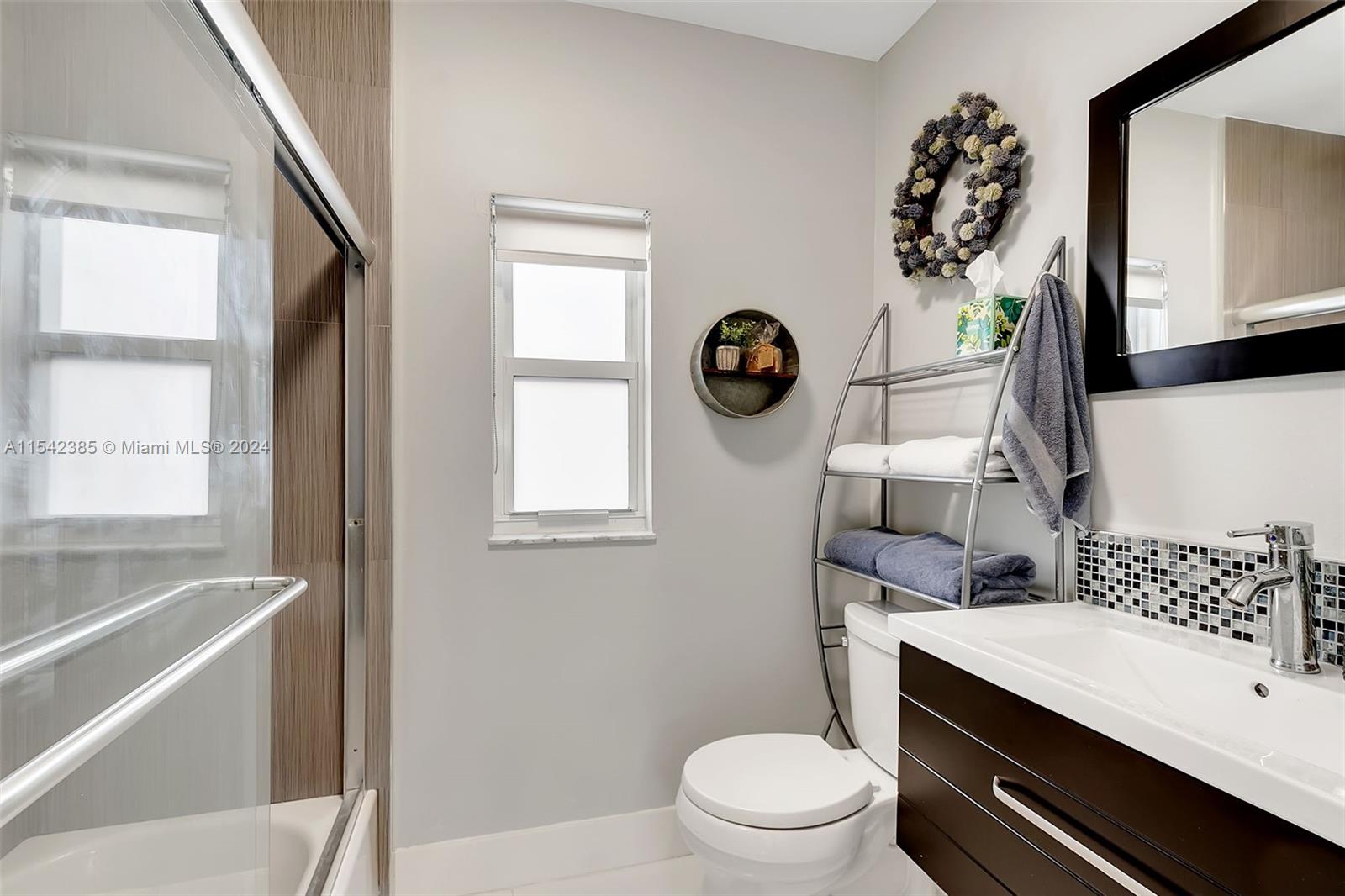 2521 Southwest 25th Terrace Miami, FL 33133 - Photo 16 of 26 a bathroom with a sink a toilet and a bathtub