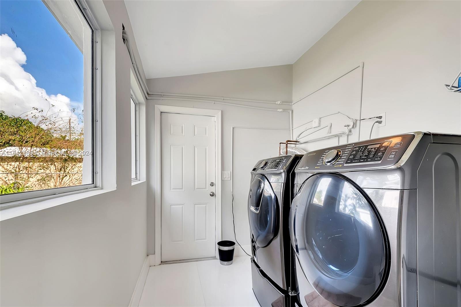 2521 Southwest 25th Terrace Miami, FL 33133 - Photo 17 of 26 a utility room with dryer and washer