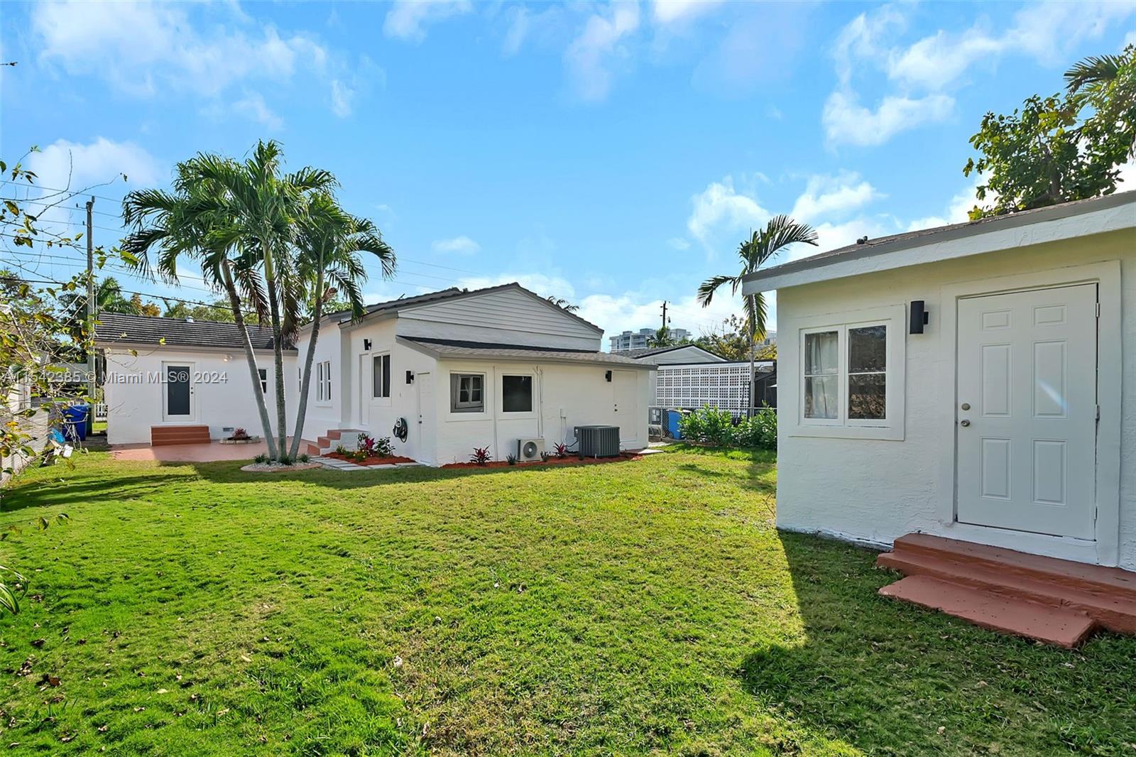 2521 Southwest 25th Terrace Miami, FL 33133 - Photo 18 of 26 a front view of a house with a yard