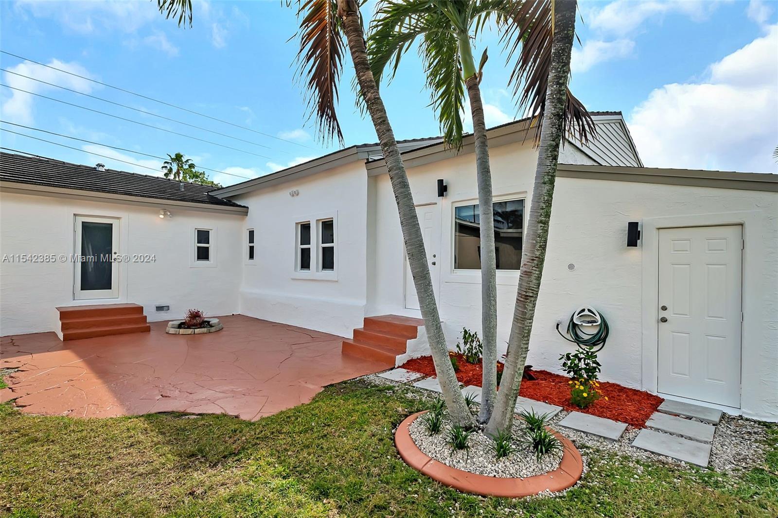 2521 Southwest 25th Terrace Miami, FL 33133 - Photo 19 of 26 a backyard of a house with table and chairs