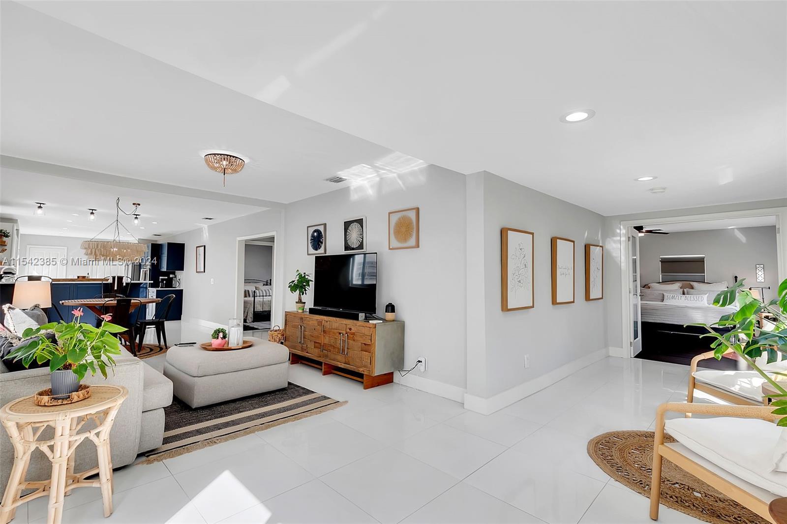 2521 Southwest 25th Terrace Miami, FL 33133 - Photo 6 of 26 a living room with furniture and a flat screen tv
