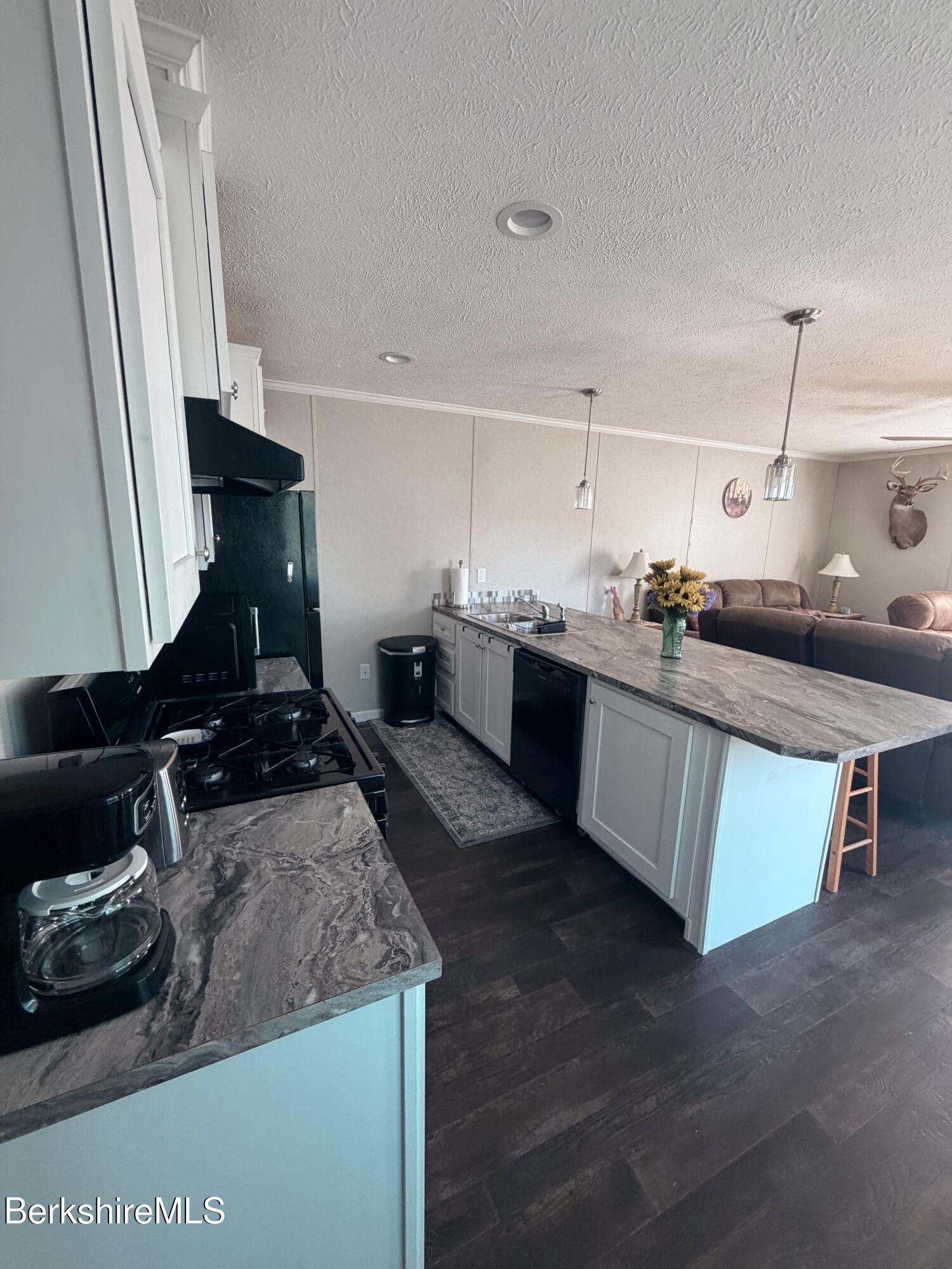 29 4th Avenue Cheshire, MA 01225 - Photo 2 of 13 a kitchen with sink stove and cabinets