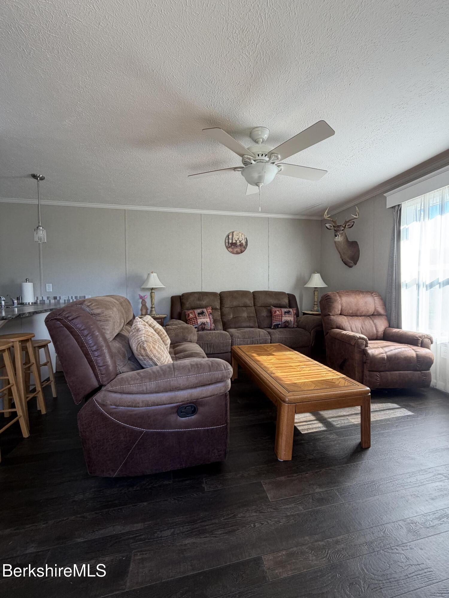 29 4th Avenue Cheshire, MA 01225 - Photo 4 of 13 a living room with furniture and a lamp