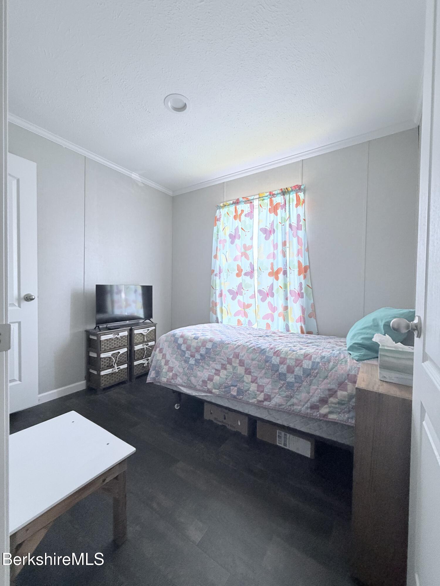 29 4th Avenue Cheshire, MA 01225 - Photo 5 of 13 a bedroom with a bed and a tv on the dresser