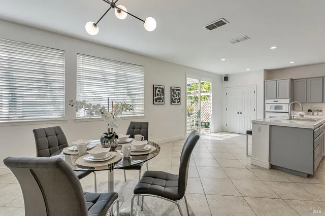 a view of a dining room with furniture window and outside view