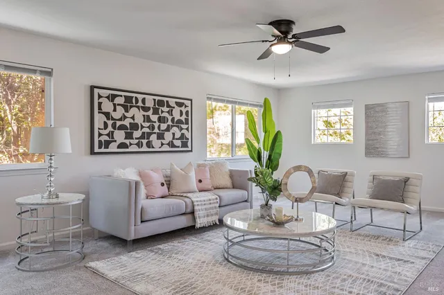 a work room with furniture and a window
