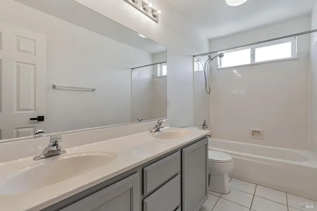 a bathroom with a sink a vanity and a mirror