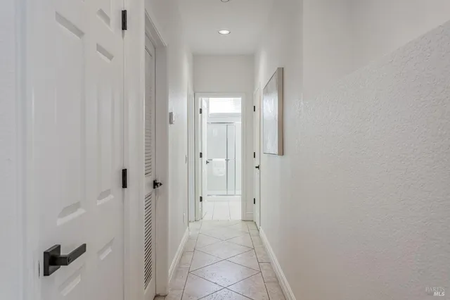 a white toilet sitting next to a window