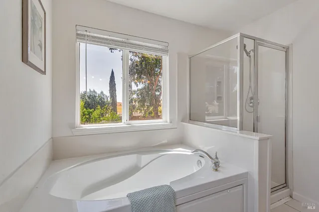 a utility room with sink dryer and washer